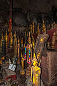 Luang Prabang, Laos - The Pak Ou Caves, the upper cave called Tam Theung. The caves, a Buddhist pilgrimage site, are a repository of old Buddha statues.